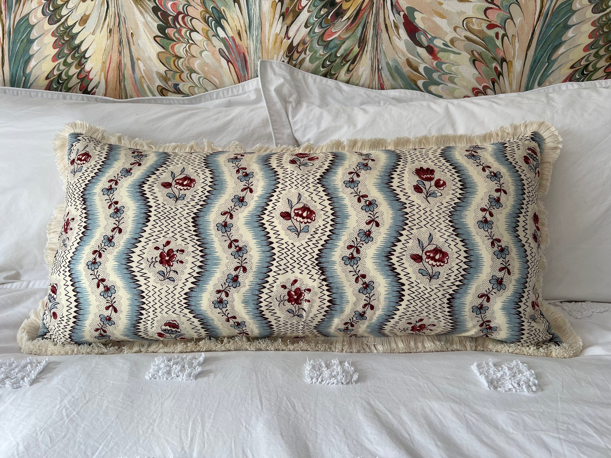 Cushions in Pierre Frey Le Manach Greuze fabric. Bleu Rouge colourway