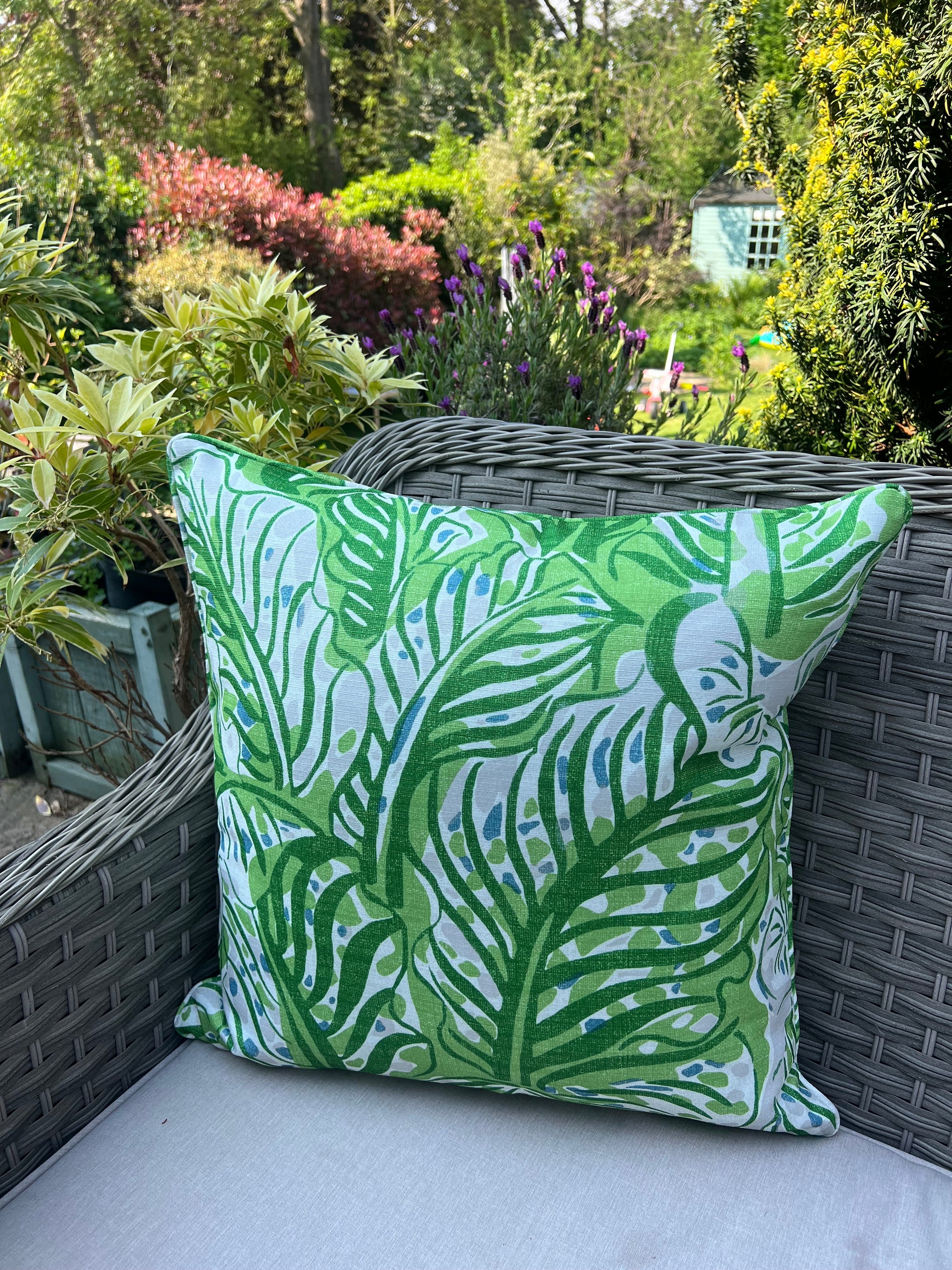 Luxury cushions in Christopher Farr Millie Feuille Outdoor fabric. Designer patio garden cushions